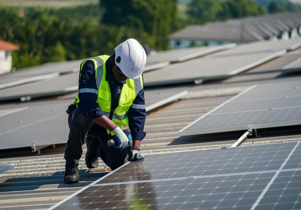 Technology solar cell, Engineer service check installation solar cell on the roof of factory. technician checks the maintenance of the solar panels